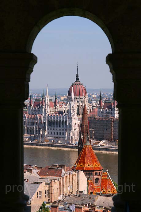 Parliament view through the arch of fishermen s bastion Budapest 