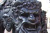 Testy Face Of Lion On Lamppost Base In Budapest 